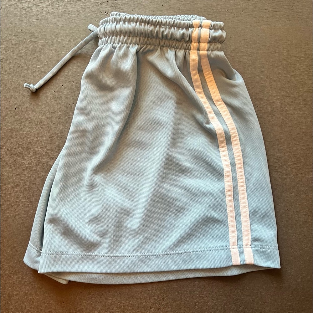 Light Blue shorts, side white stripes.
